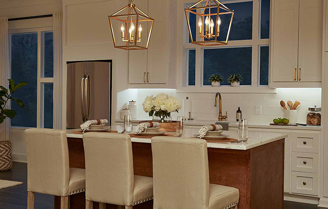 Kitchen illuminated by under cabinet lights.