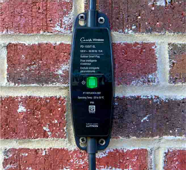 Smart outdoor plug monted on a house outside