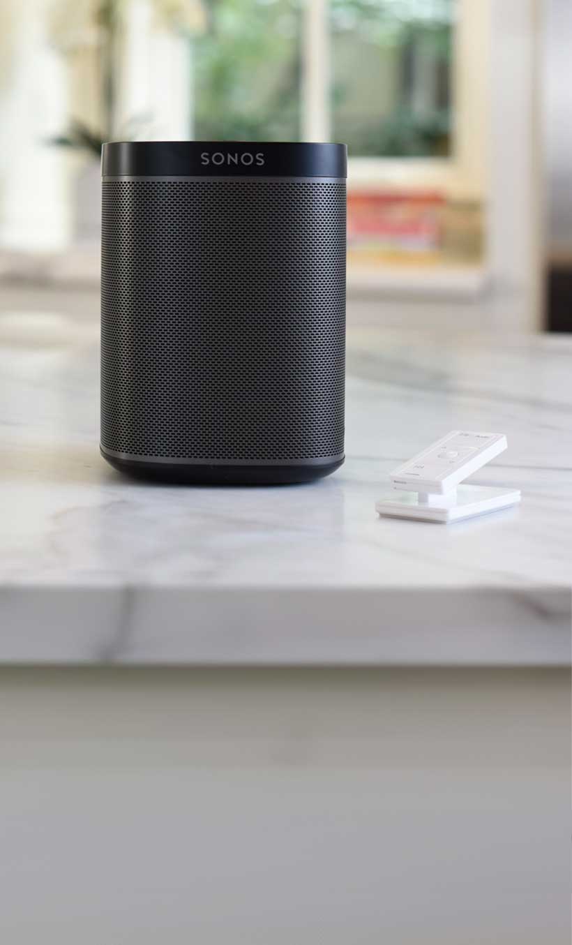 Pico Remote Pedestal sitting on kitchen counter nex to Sonos speaker