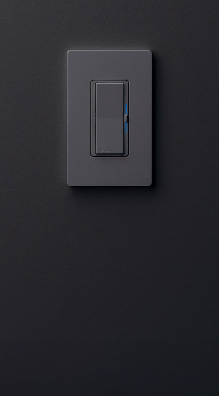 Smart switch in black on a dark charcoal painted wall