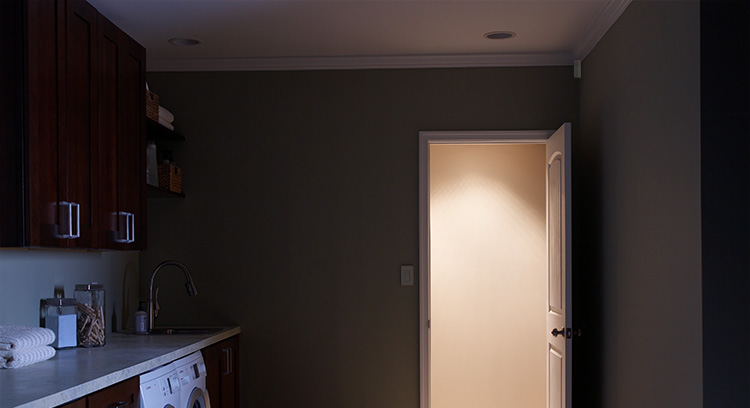 Empty laundry room with lights off